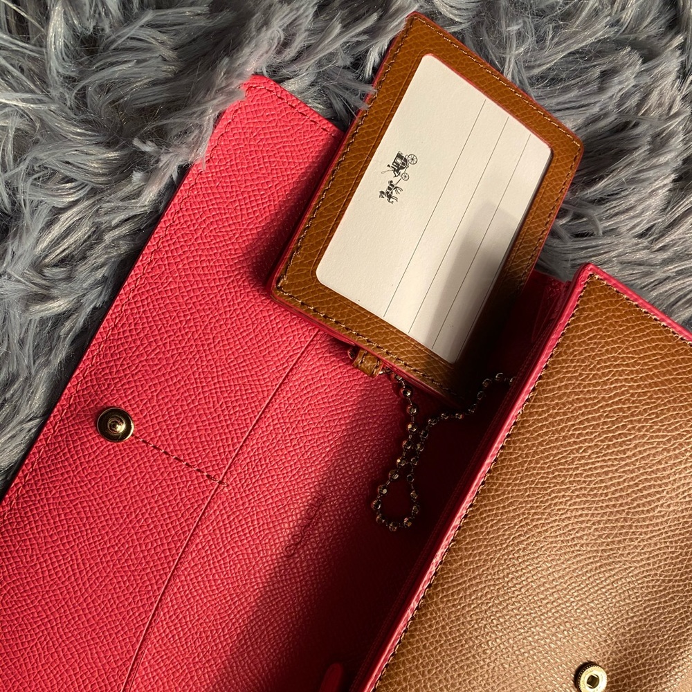 COACH  trifold wallet with ID chain.